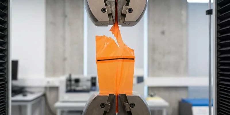 Tensile testing machine tearing TPU fabric while the HF welded seam remains intact