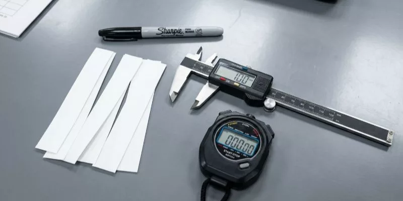 Professional waterproof bag testing tools set on a lab table